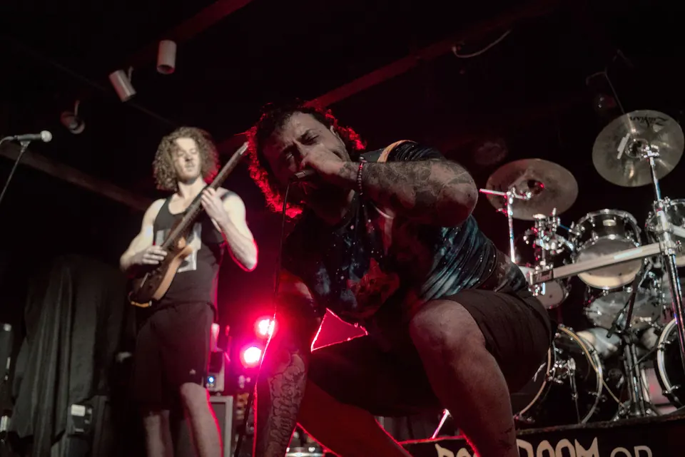 A guitarist from Emulsified playing at the Doom Room