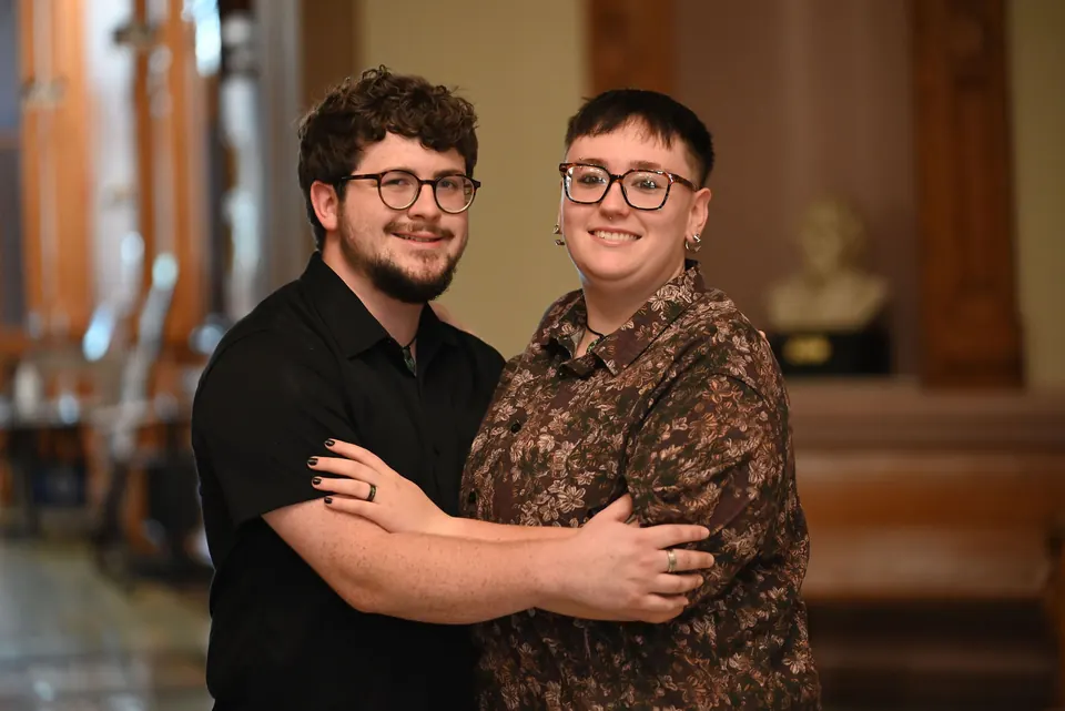 Aaron and Ethan embracing in the courthouse after their ceremony