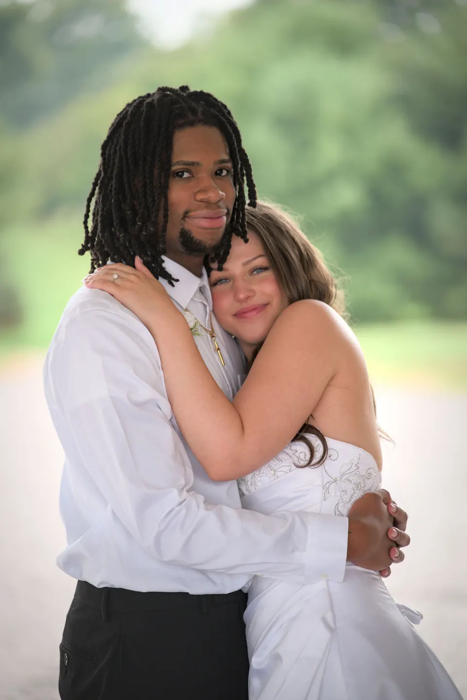 Kassie and Noah embracing outside after the ceremony