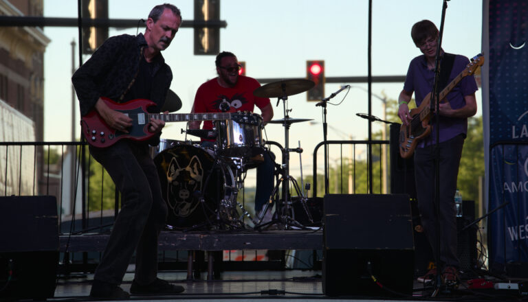 Jason Wells Band playing an outdoor stage at dusk